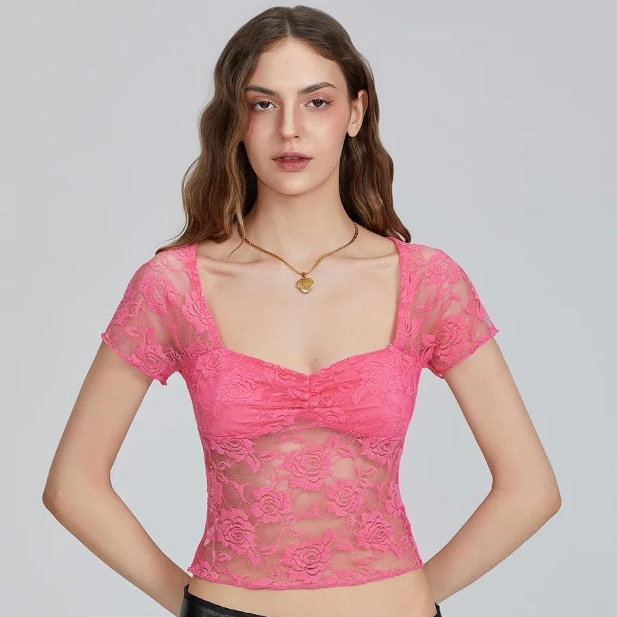 Elegant pink lace women's top with floral design, semi-sheer fabric, fitted style, perfect for fashion or special occasions.