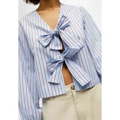 Elevate your wardrobe with this chic striped blouse featuring fashionable bow ties. Ideal for casual outings, work, or brunch, making it a versatile addition to any wardrobe. Shop now for stylish, quality women's tops at Monalisa Medical.