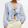 Elegant blue and white striped blouse with front bow ties, perfect for stylish casual wear or office outfits. Comfortable lightweight fabric with long puff sleeves.