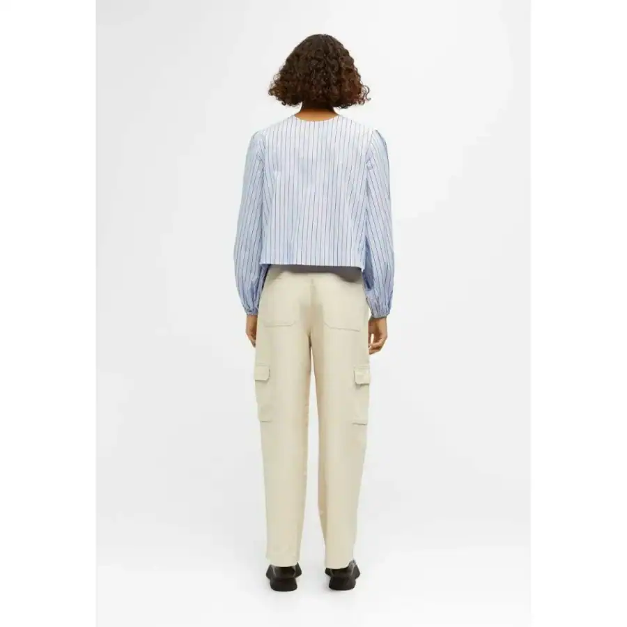 Comfortable women's casual clothing from Monalisa Store, featuring a striped blouse and beige cargo pants perfect for everyday wear and stylish comfort.