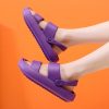 Colorful purple sandals designed for casual, summer comfort with adjustable straps and durable soles, perfect for an active lifestyle and stylish everyday wear.