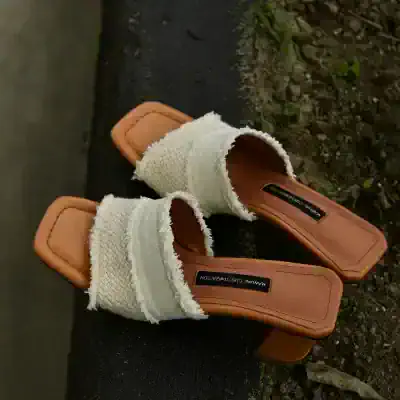 Comfortable white woven slip-on sandals with tan square toe soles, ideal for stylish casual wear and perfect for summer fashion.