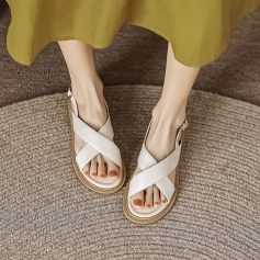 Stylish white sandals with crisscross straps, perfect for casual and summer wear, available at Monalisa Medical Store.