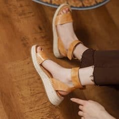 Comfortable tan leather wedge sandals perfect for casual and summer outfits. Features a breathable design with a sturdy espadrille sole, ideal for everyday wear and outdoor activities.