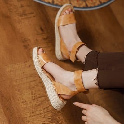 Comfortable tan leather wedge sandals perfect for casual and summer outfits. Features a breathable design with a sturdy espadrille sole, ideal for everyday wear and outdoor activities.
