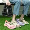 Alt text: Colorful casual sandals displayed on green grass, perfect for summer wear, featuring adjustable straps for a secure fit.