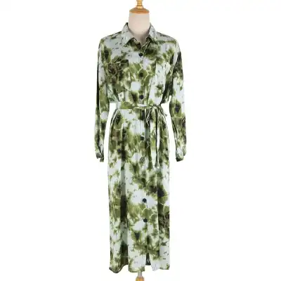 Stylish green and white floral maxi dress with button-down front, long sleeves, and waist tie, perfect for summer fashion and casual outings.