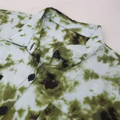 Vibrant green black tie-dye pattern shirt with buttons, perfect for stylish casual outfits and boutique fashion shopping.