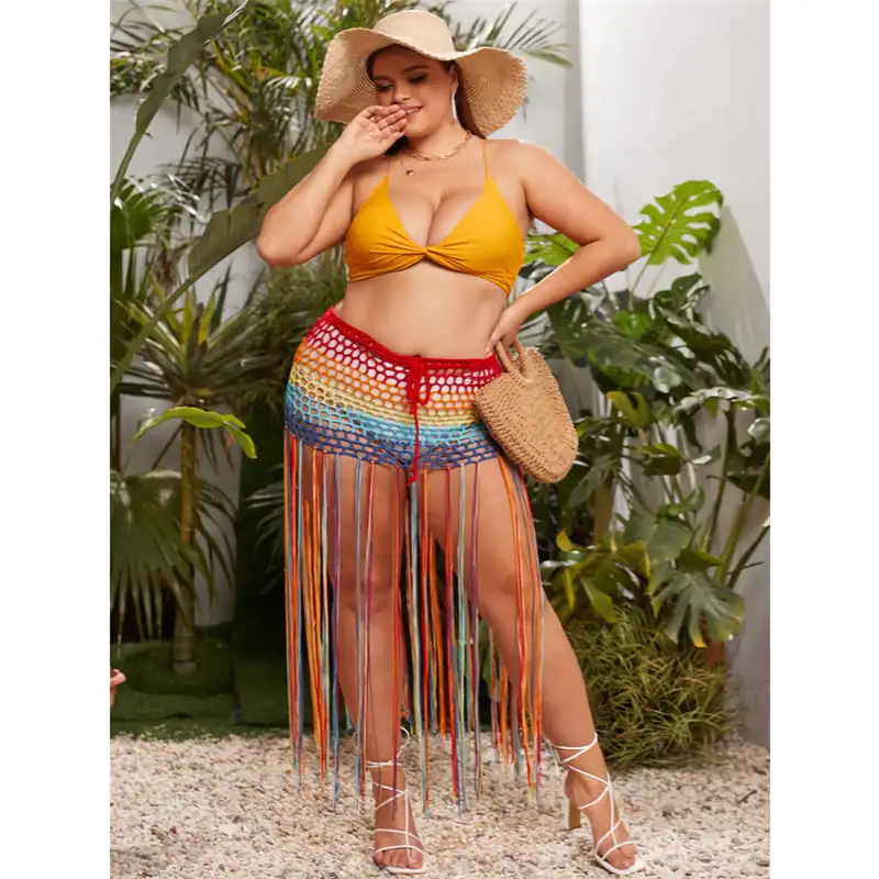Detailed description of a woman wearing colorful crochet shorts, a yellow bikini top, and stylish white lace-up heels, accessorized with a straw hat and woven handbag, standing among lush tropical plants.