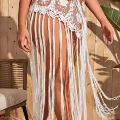 Elegant crochet bohemian skirt with fringe design, perfect for beachwear and summer fashion. Made with lightweight material, offering a stylish and comfortable look for women.
