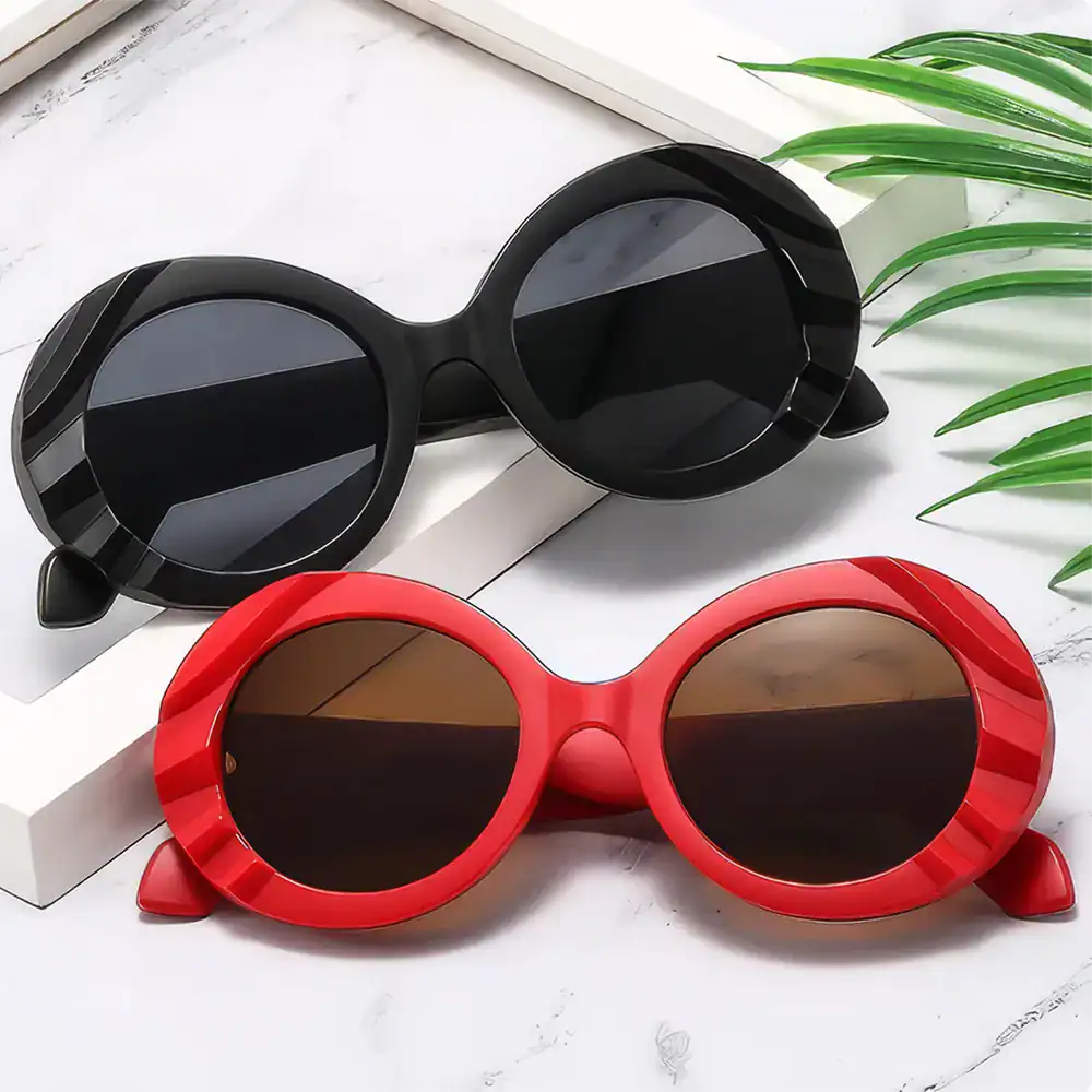 Stylish round sunglasses with black and red frames, perfect for UV protection and fashion statements. Ideal for sunny days, available at Monalisa Store for trendy eyewear.