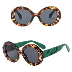 Elegant tortoise shell sunglasses with dark lenses, perfect for stylish sun protection and enhancing your fashion statement.