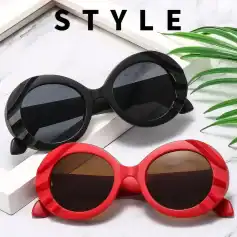 Stylish oval sunglasses with bold black and red frames, perfect for fashion-forward individuals seeking trendy eye accessories.
