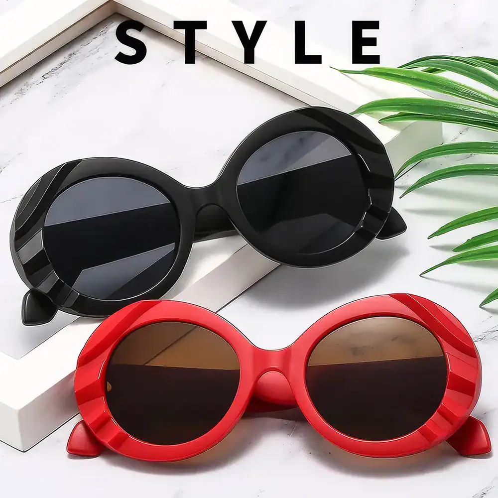 Stylish oval sunglasses with bold black and red frames, perfect for fashion-forward individuals seeking trendy eye accessories.