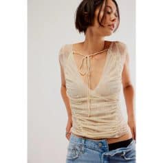 Stylish women's lace sheer top with tie-front detail, perfect for fashion-forward looks and versatile styling.