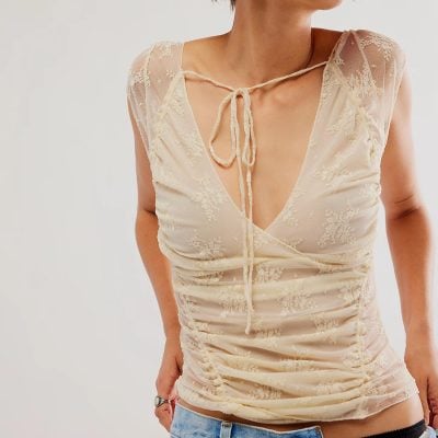 Lace women's blouse with tie neckline, delicate floral pattern, chic design, perfect for casual or dressy occasions, available at Monalisa Store for fashionable apparel.