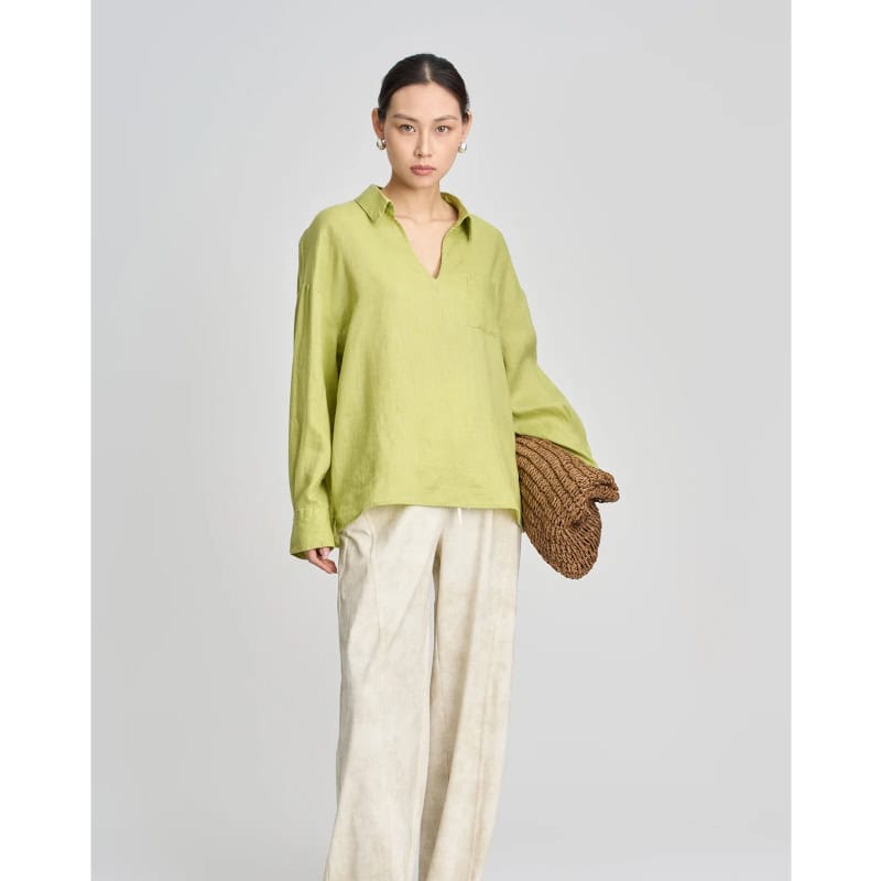 Elegant lime green women's oversized shirt for fashion-forward looks, perfect for casual or semi-formal occasions, made from lightweight, breathable fabric.