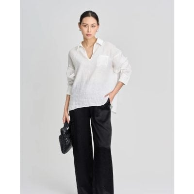Elegant women's white blouse with a pocket, long sleeves, and a V-neck, perfect for professional and casual wear. Crafted with comfortable fabric for versatile styling.