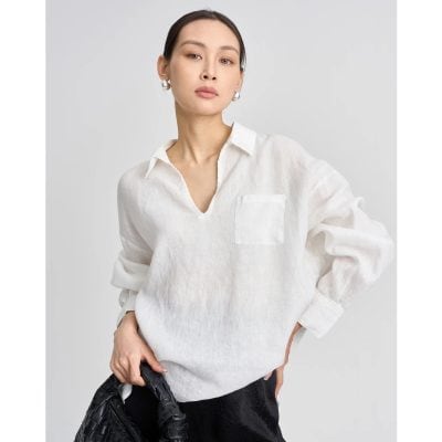 Stylish white linen blouse with a front pocket, perfect for casual or professional wear. Lightweight, comfortable, and chic, ideal for fashion-forward women seeking versatile office and weekend style.
