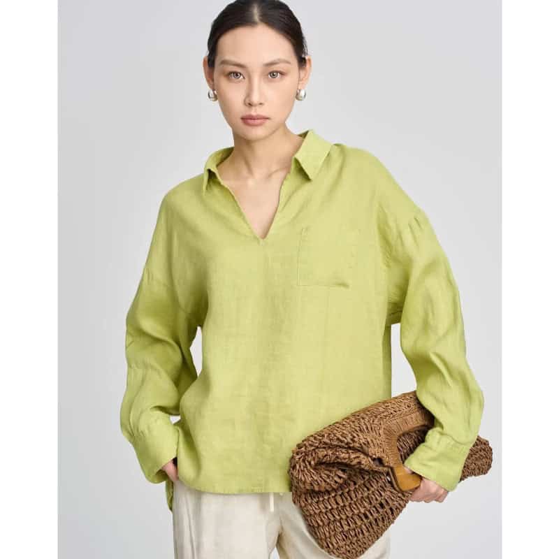 Elegant linen blouse with a classic collar, long sleeves, and a soft lime green color–perfect for stylish, comfortable fashion.