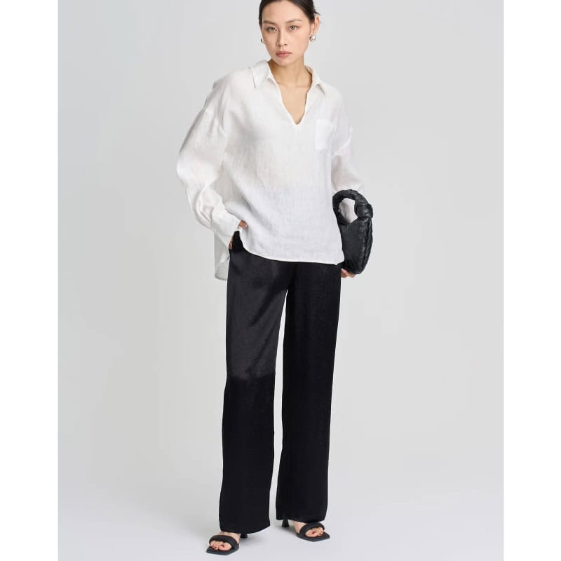Elegant white blouse for women, perfect for office and casual wear, featuring a comfortable fit and timeless style.