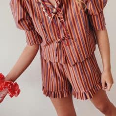 Vibrant striped sleepwear featuring a matching top and shorts, ideal for cozy nights or lounging in style.