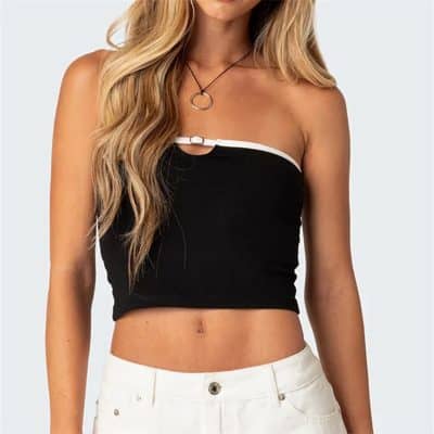 Girl wearing fashionable black crop top with white trim, perfect for summer or casual outings.