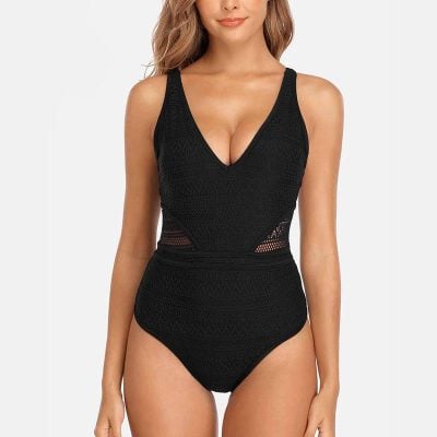 A stylish black crochet one-piece swimsuit featuring a V-neck design with mesh details on the sides, perfect for beach or poolside lounging.