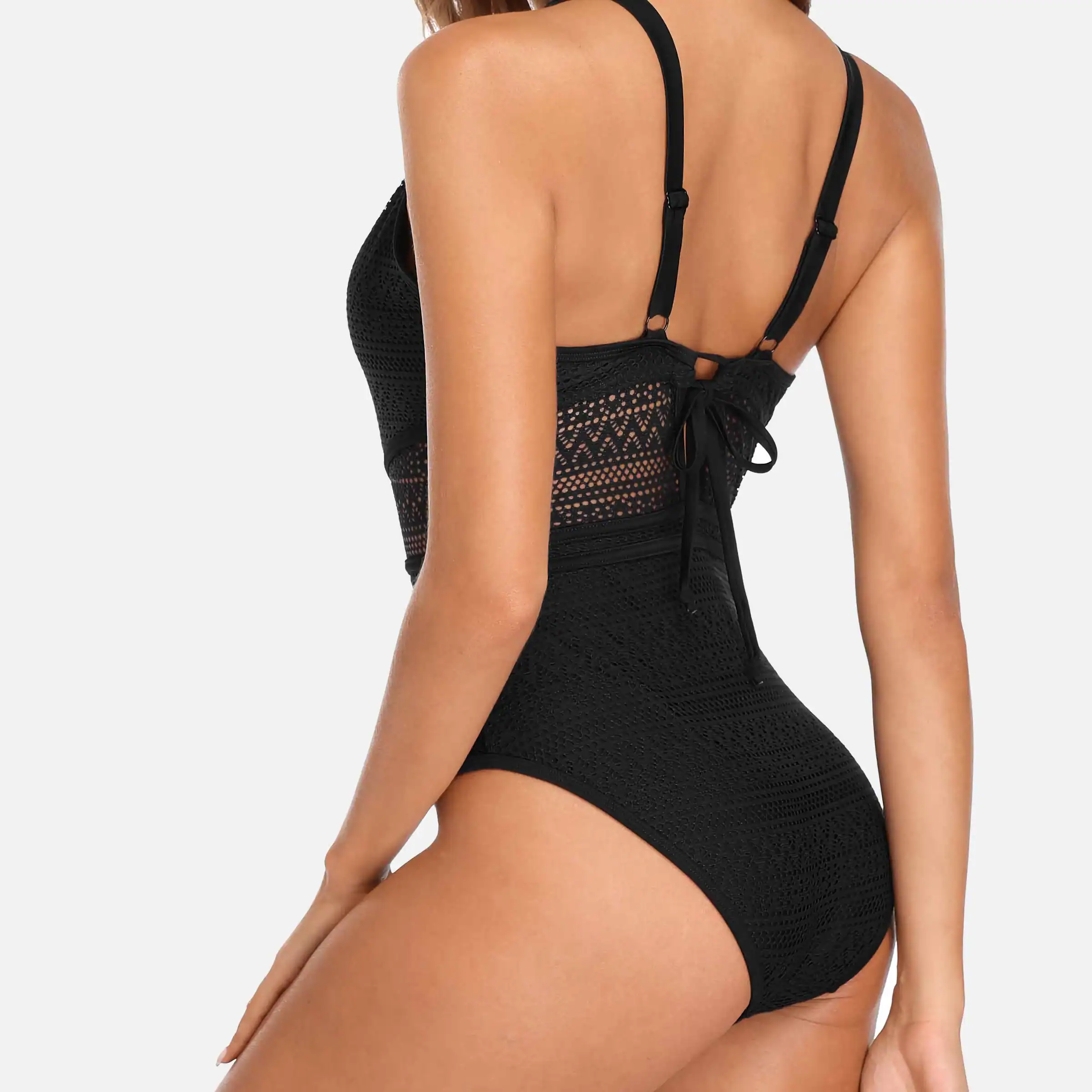 High-quality black lace bodysuit featuring adjustable straps, intricate lace detailing, and a stylish back bow for a fashionable and comfortable fit. Perfect for stylish beachwear or summer lounging.