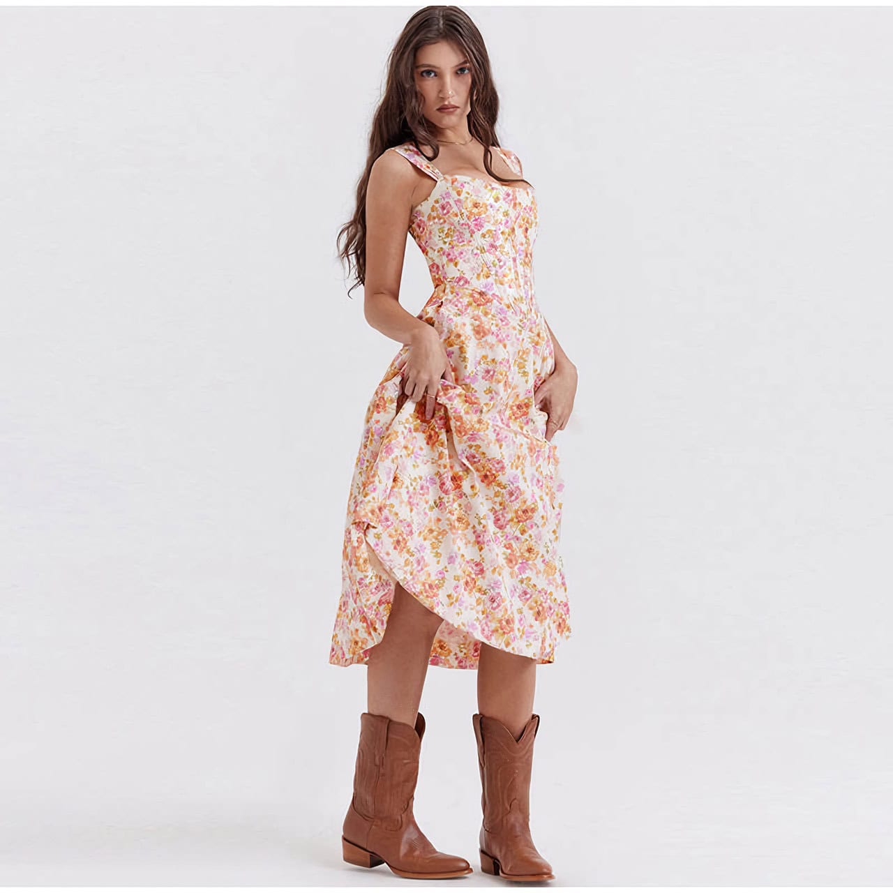 A woman modeling a floral midi dress with ruffle straps and side slit, highlighting summer fashion, casual style, and feminine clothing. Perfect for stylish, comfortable summer wear and outdoor events.