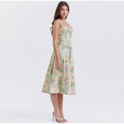 Elegant women's floral midi dress perfect for spring and summer occasions, featuring a fitted bodice, sleeveless design, and a flowing A-line skirt. Great for casual or semi-formal events.