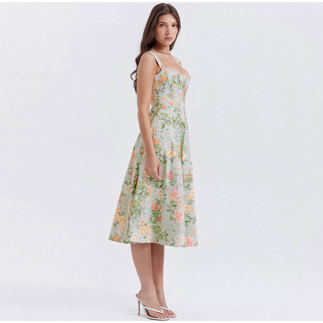 Elegant women's floral midi dress perfect for spring and summer occasions, featuring a fitted bodice, sleeveless design, and a flowing A-line skirt. Great for casual or semi-formal events.