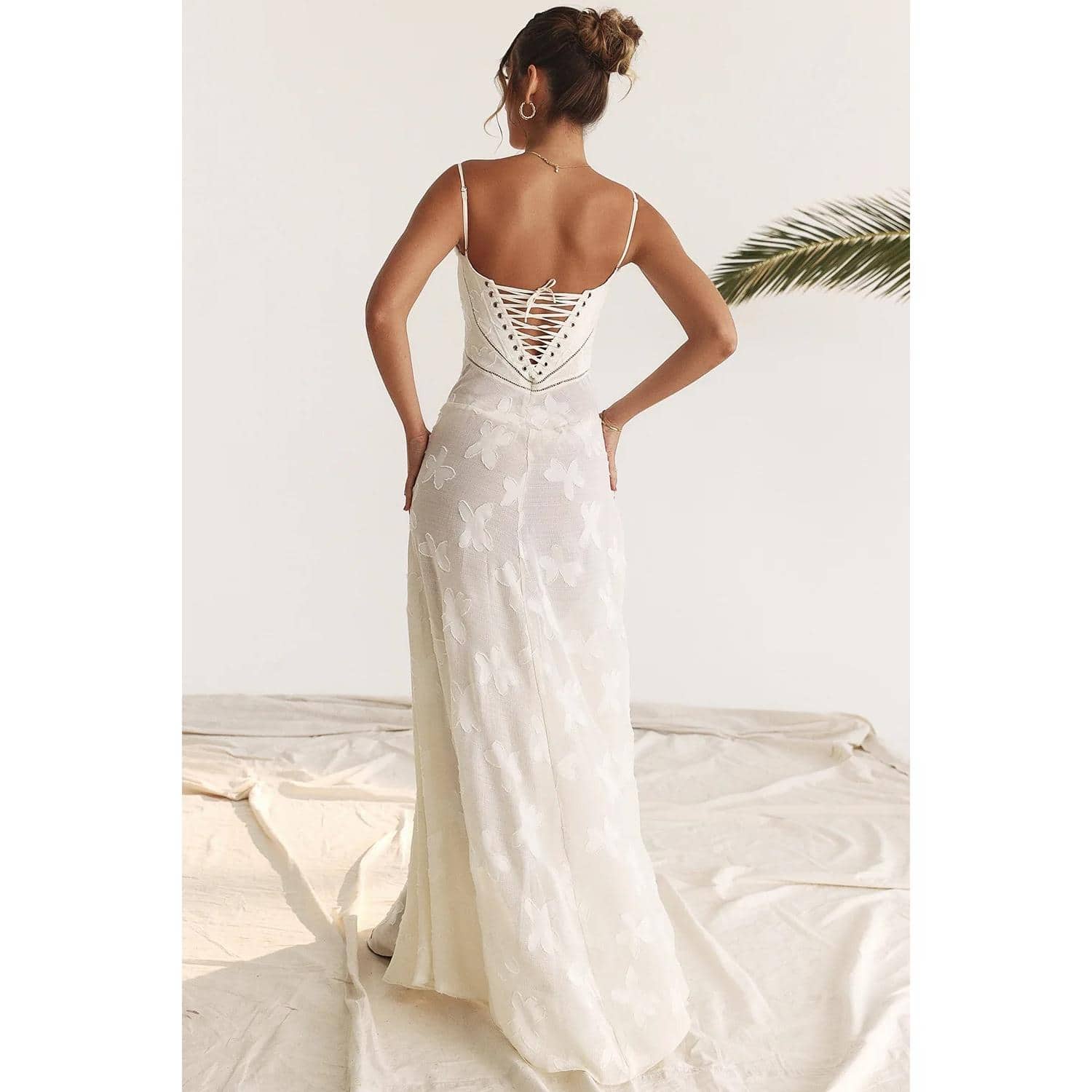 Beautiful white wedding gown featuring intricate lace-up back and floral embroidery design, perfect for special occasions and weddings from Monalisa Store.