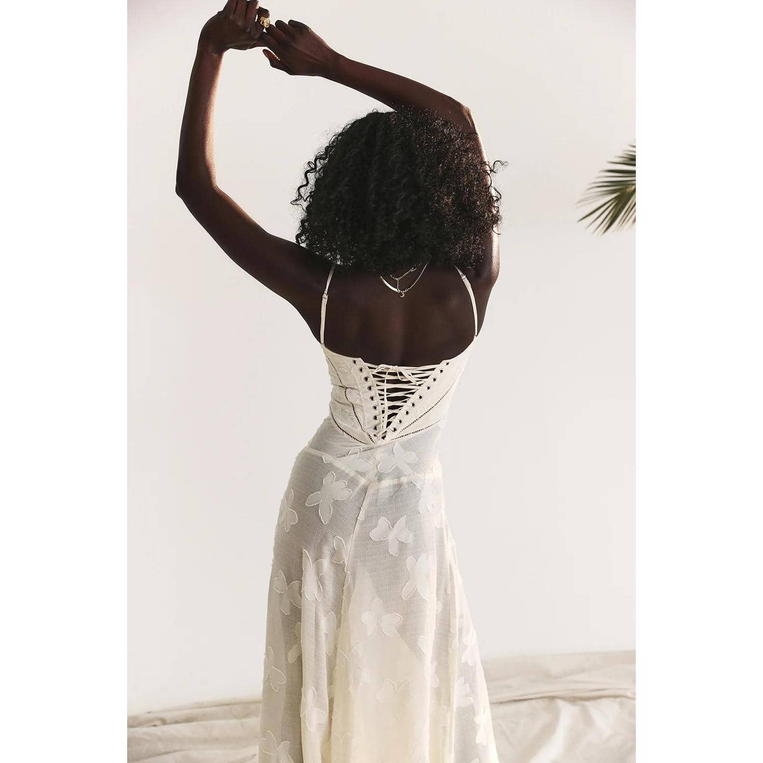 Fashionable and comfortable women’s summer dress featuring butterfly embroidery, a lace-up back design, perfect for casual or beachwear.