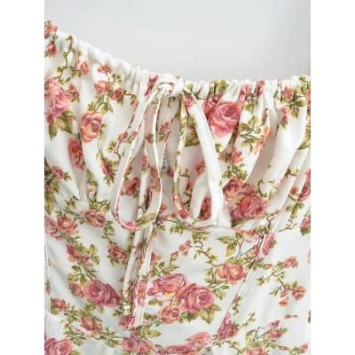 Soft floral sleepwear with pink roses on a white background, featuring a drawstring waistband for comfort. Perfect for cozy nights and relaxed lounging.