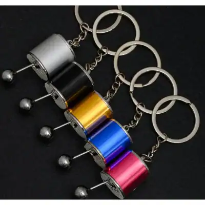Keychain accessories with metallic finish in multiple vibrant colors, ideal for gifts, promotional items, or personal use. Features silver rings and sturdy chain links suited for stylish, trendy, and functional key holders.