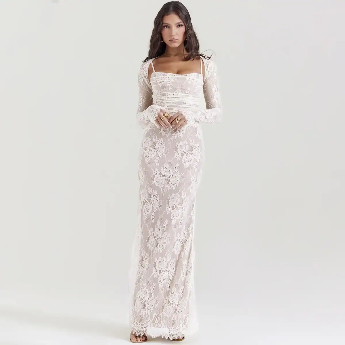 Lace evening gown featuring intricate floral patterns, long sleeves, and a fitted silhouette perfect for formal events and weddings.