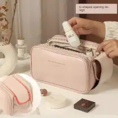 A travel skincare kit featuring SK-II product, cosmetic bag, and accessories showcased on a white surface with decorative elements, ideal for beauty and skincare routines.