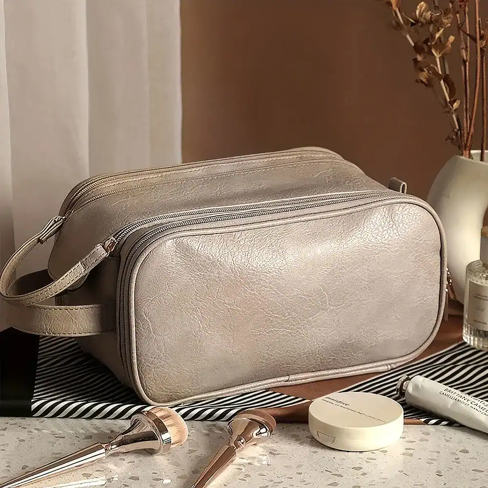 Elegant beige cosmetic bag with multiple compartments for skincare, makeup tools, and beauty essentials. Perfect for organizing and travel.