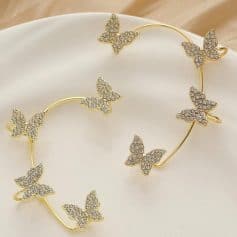 Elegant butterfly-themed gold jewelry with sparkling cubic zirconia accents, perfect for stylish women and special occasions.