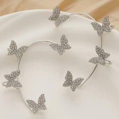 Elegant butterfly jewelry set featuring silver-tone cuff bracelet and ring with sparkling rhinestones, perfect for women seeking luxurious and fashionable accessories.