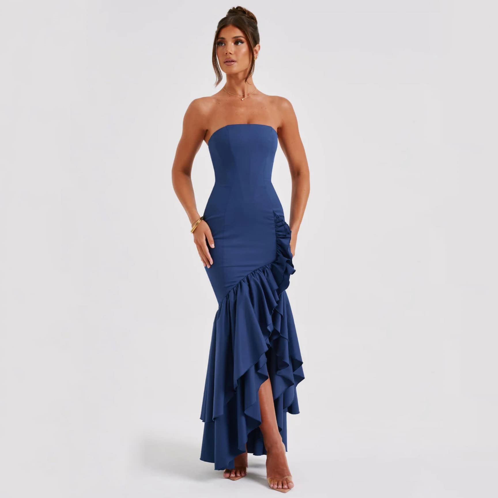 Elegant royal blue strapless ruffled gown perfect for formal events and special occasions. Features a fitted bodice with intricate ruffle detailing from the knee to the hem.