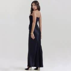 Versatile black strapless gown with high heels, suitable for formal events, parties, or elegant outings. A chic choice for women seeking fashionable and sophisticated attire.