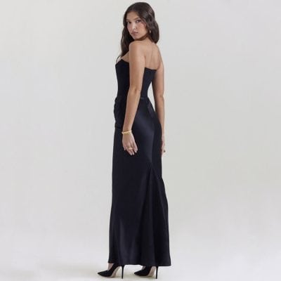 Versatile black strapless gown with high heels, suitable for formal events, parties, or elegant outings. A chic choice for women seeking fashionable and sophisticated attire.