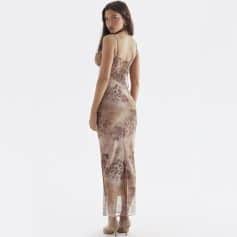 Stunning leopard-print long dress with elegant design, perfect for formal occasions, complemented by nude heels. Showcases stylish, sophisticated women's fashion from Monalisa Medical.