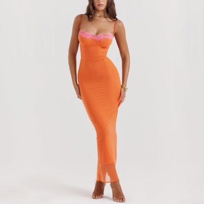Stylish orange maxi dress featuring pink lace accents, perfect for fashionable outings and special occasions. The form-fitting design enhances your silhouette, paired with clear heels for a chic look.