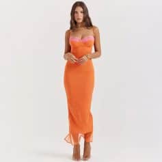 Fashionable orange dress with pink lace accents, body-hugging fit, and spaghetti straps. Perfect for stylish occasions and evening events, highlighting confidence and chic style.