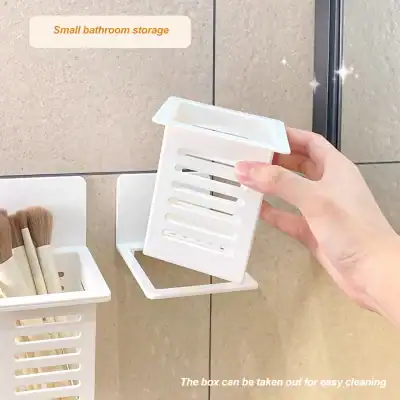 Durable white plastic bathroom organizer for toothbrushes, toothpaste, and small toiletries, ideal for bathroom wall mounting, keeps essentials organized and easily accessible.