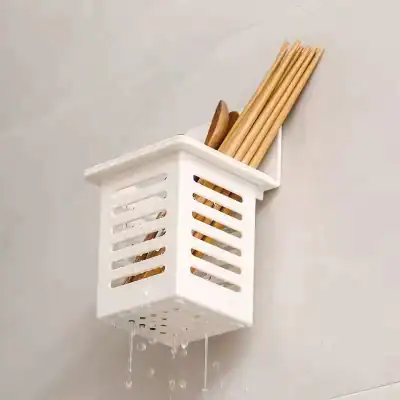 Kitchen utensil holder in bathroom.