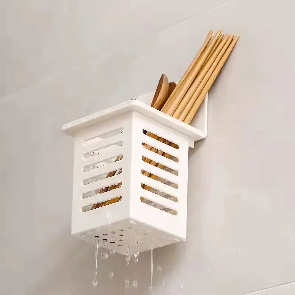 Kitchen utensil holder in bathroom.